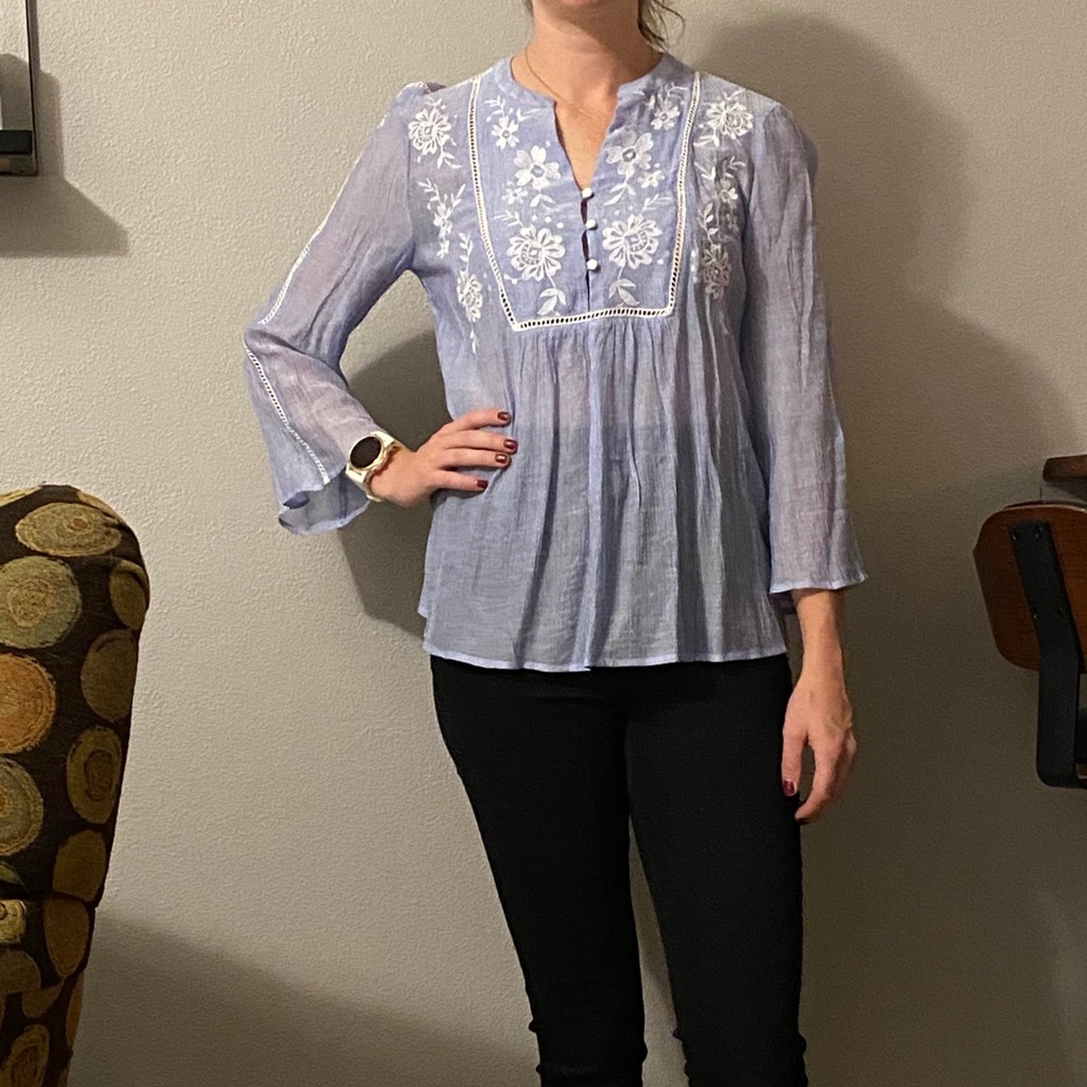 Light blue blouse with white details